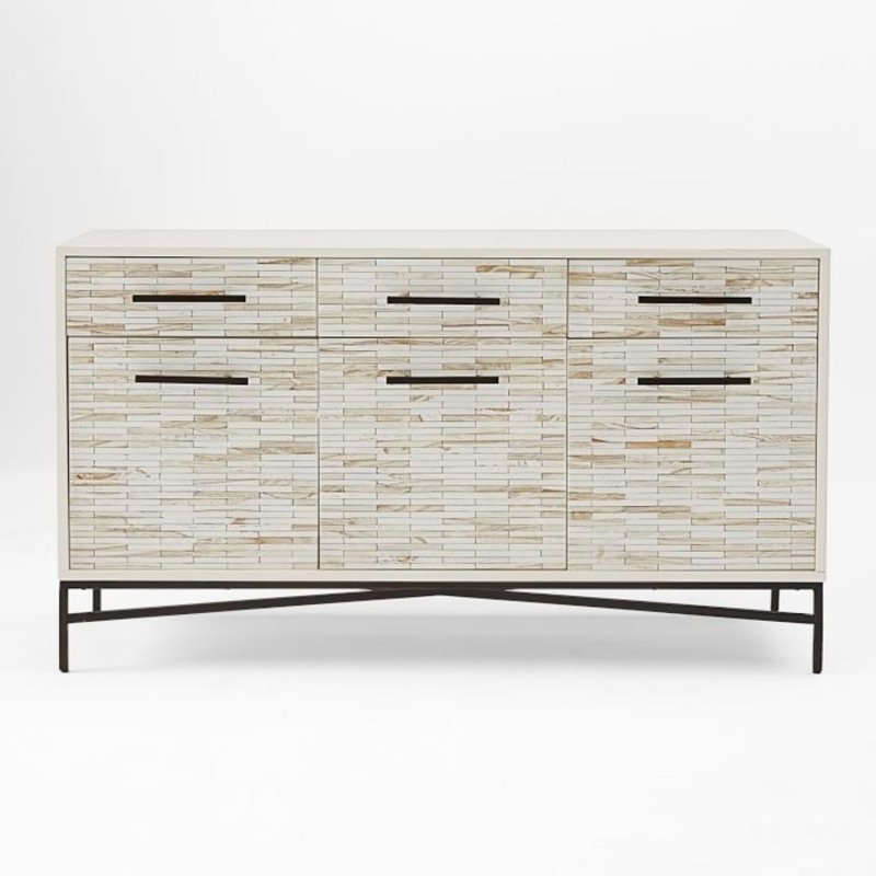 Artisan bone inlay buffet table with hand-placed cream inlay tiles across six-panel front, black metal bar pulls, and cross-brace metal trestle base