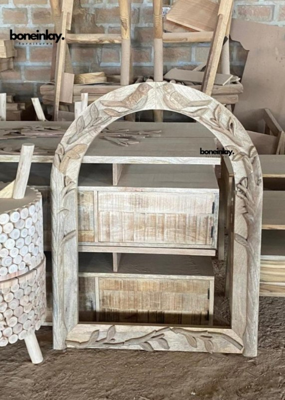 Carved bird mirror with a wooden arched frame, shown from the front with the full outline and frame visible.