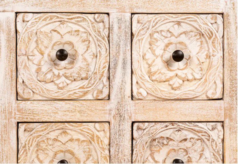 Floral carved credenza in a close-up of drawer handle details, with pale wood and carved flower panels visible.