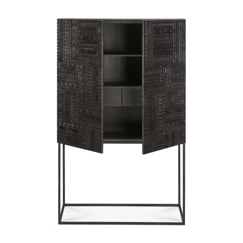 Dark wood storage cabinet in an open door view, showing interior shelves above a slim black metal base.