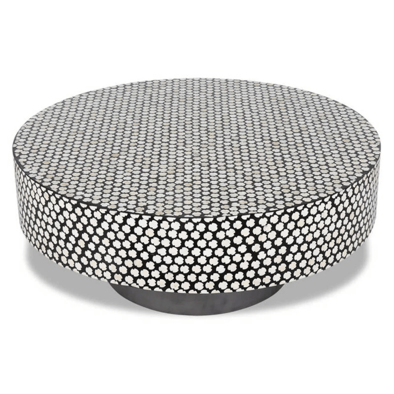 Angled view of handmade black and white clover bone inlay round center table showing inlaid tabletop surface and dark metal base