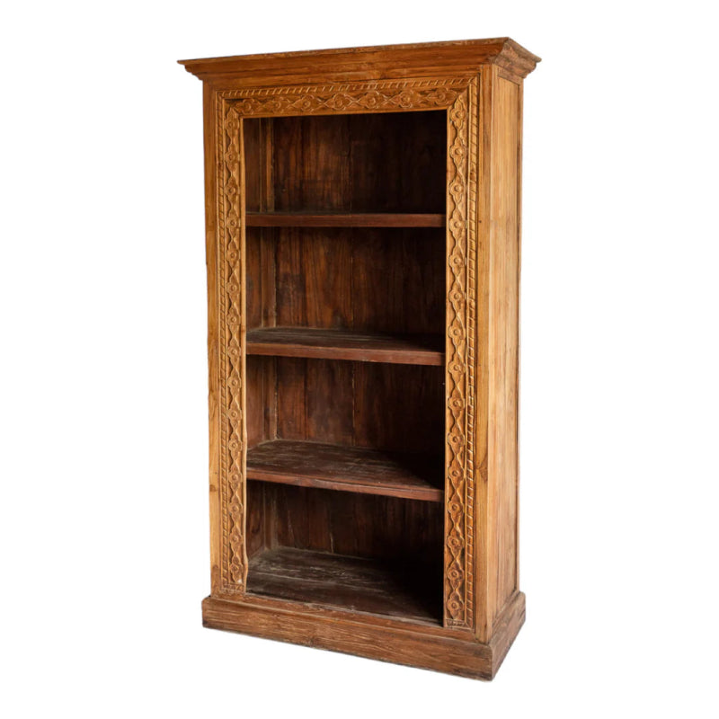 Open wood bookcase in a warm natural finish, shown at an angle with empty shelves and a carved front border.