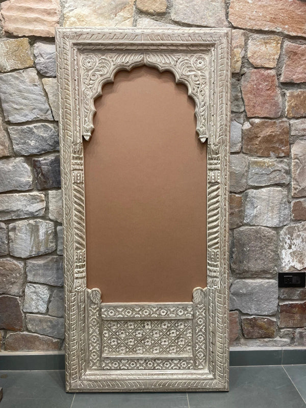 Rustic wood wall mirror with a distressed finish, front view showing a scalloped arch and floral lower panel.