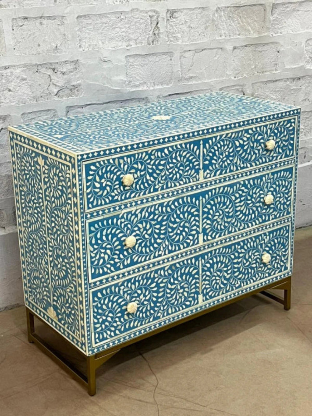 Turquoise blue handcrafted bone inlay three drawer chest with white floral spiral inlay work and gold metal base