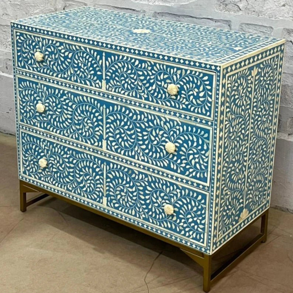 Bone inlay floral three drawer chest in turquoise blue with intricate white spiral pattern and brass frame legs