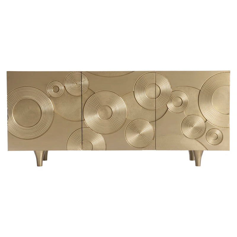 Kintore entertainment credenza media console featuring a champagne gold metal finish with a textured concentric circle pattern on short tapered legs.