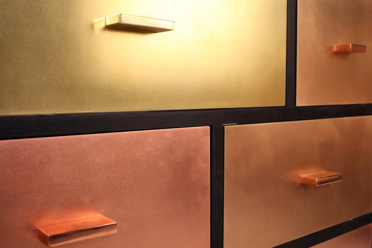 Black copper dresser with metallic sheen for bedroom decor