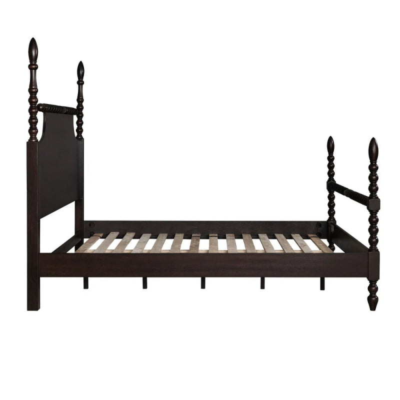 Wooden four-poster bed with a dark finish and spindle design.