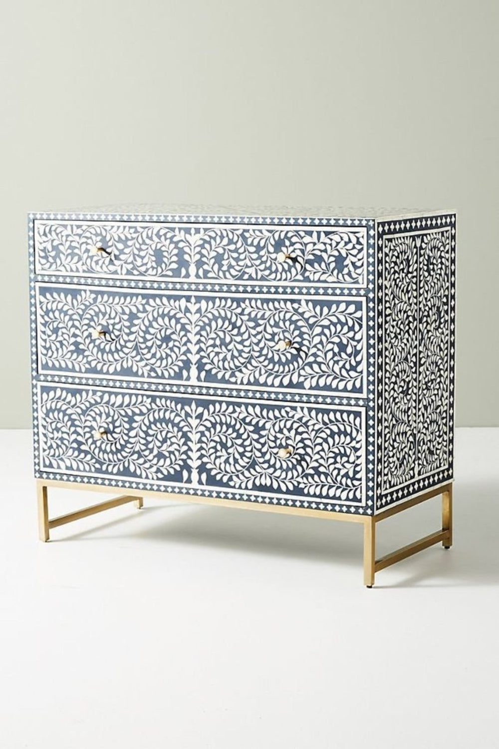 Bone Inlay Bureau in navy, shown from a three-quarter front angle with its spiral pattern, drawers, and metal frame.