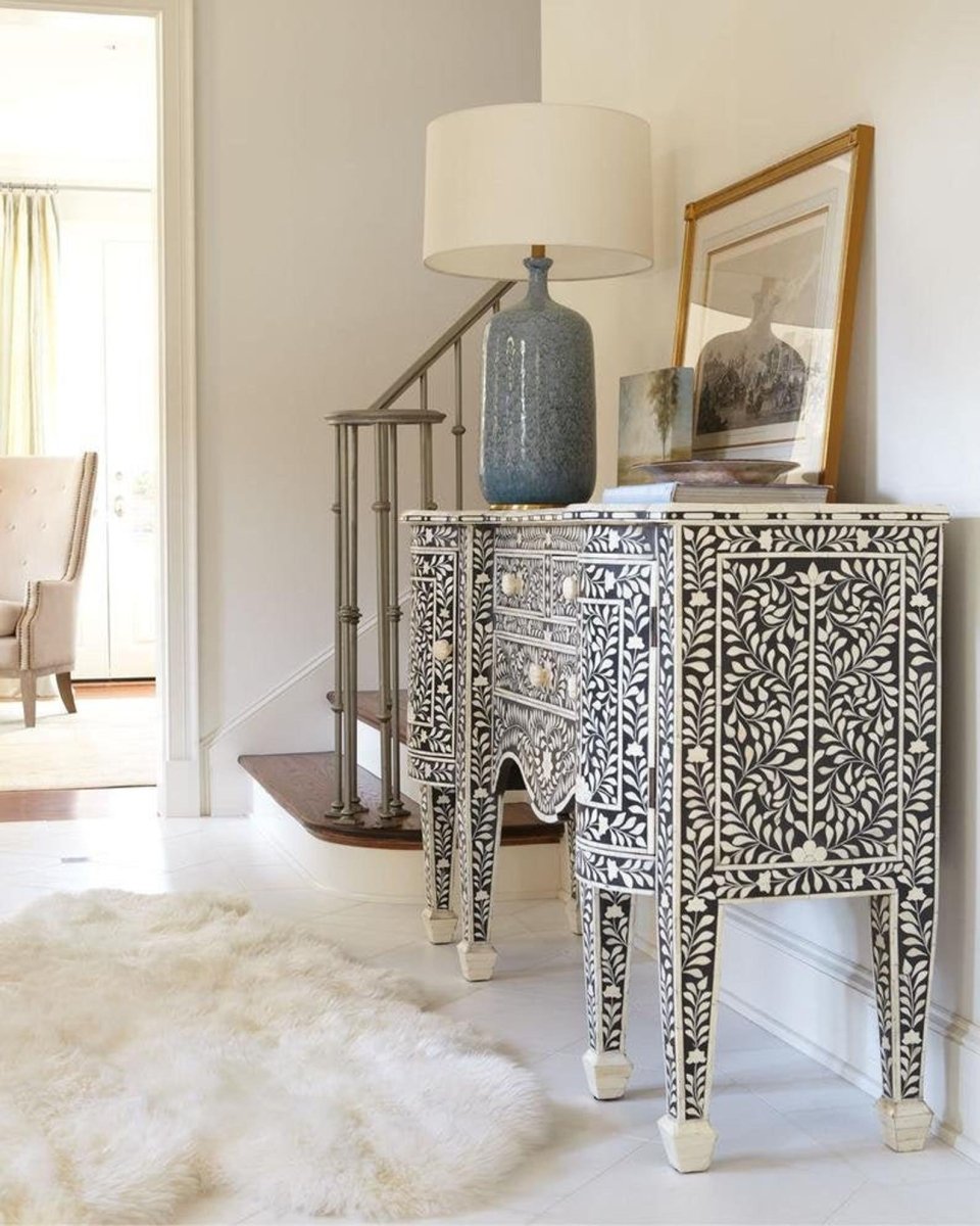 Bone Inlay Storage Cabinet in black and white, viewed from the side while styled in a home interior setting.