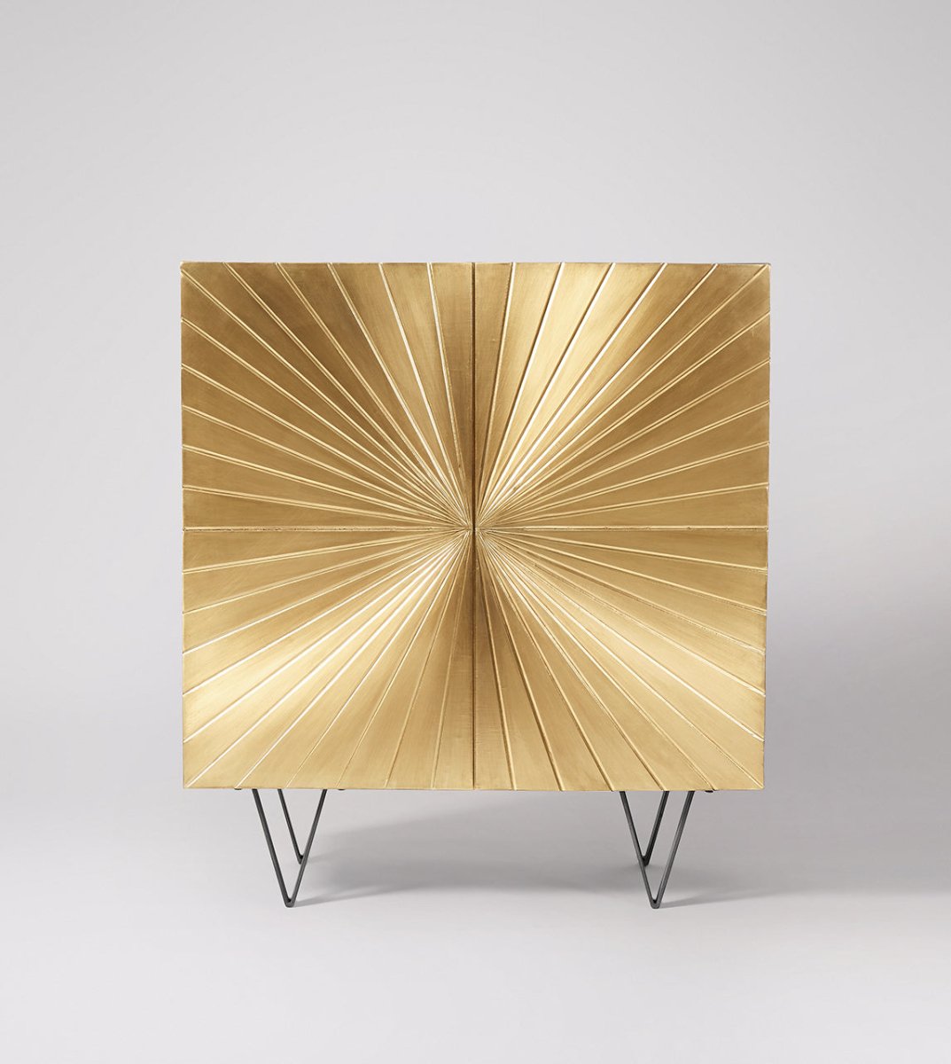hand embossed gold clad cabinet with sunbrust design