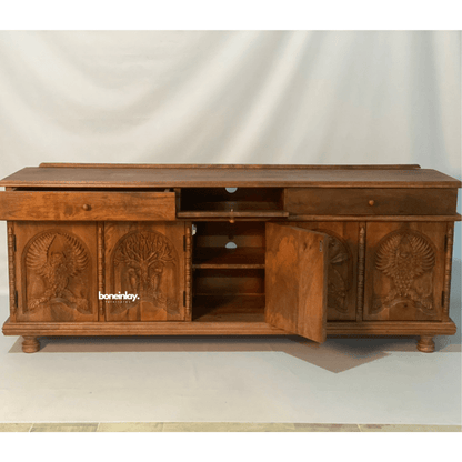 Animal relief media console in natural wood, open drawer view with a cabinet door swung out to reveal shelves.