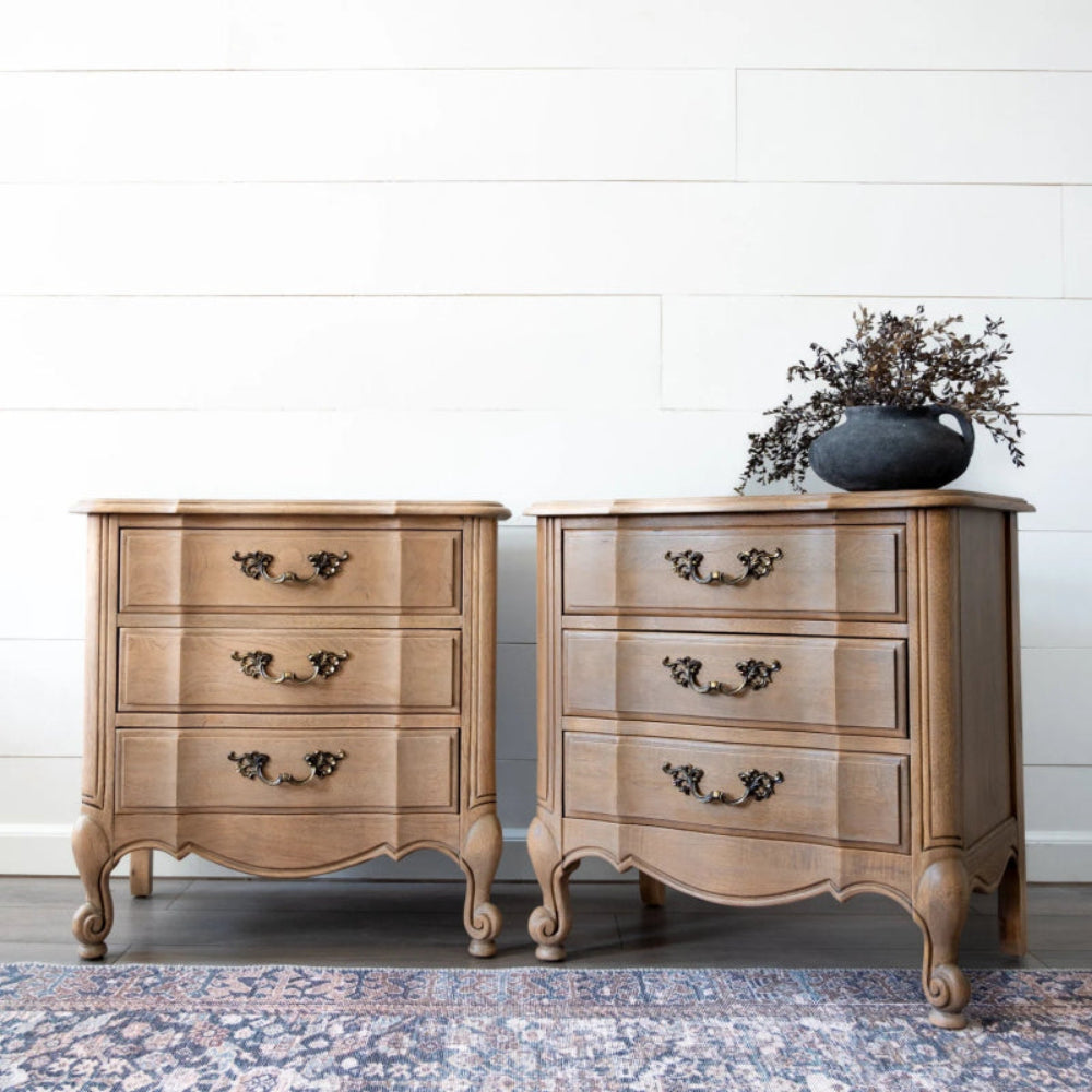 Carved brass pull nightstand with floral hardware, shown in a front view with drawers detailed.