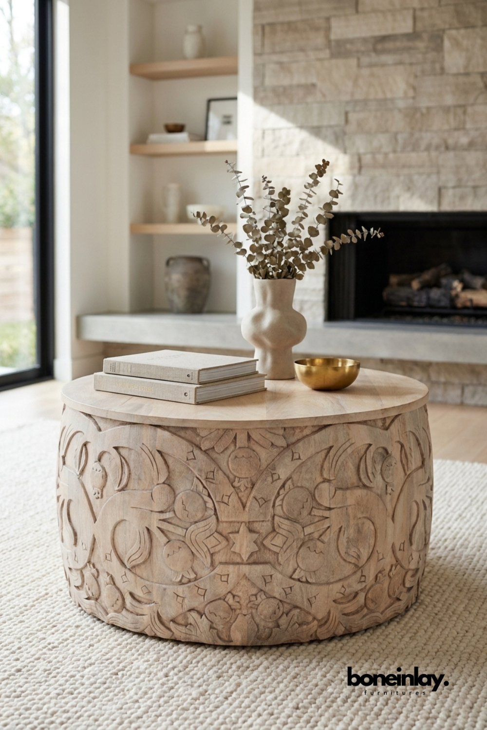Round carved wooden coffee table with hand carved floral motifs and natural wood finish