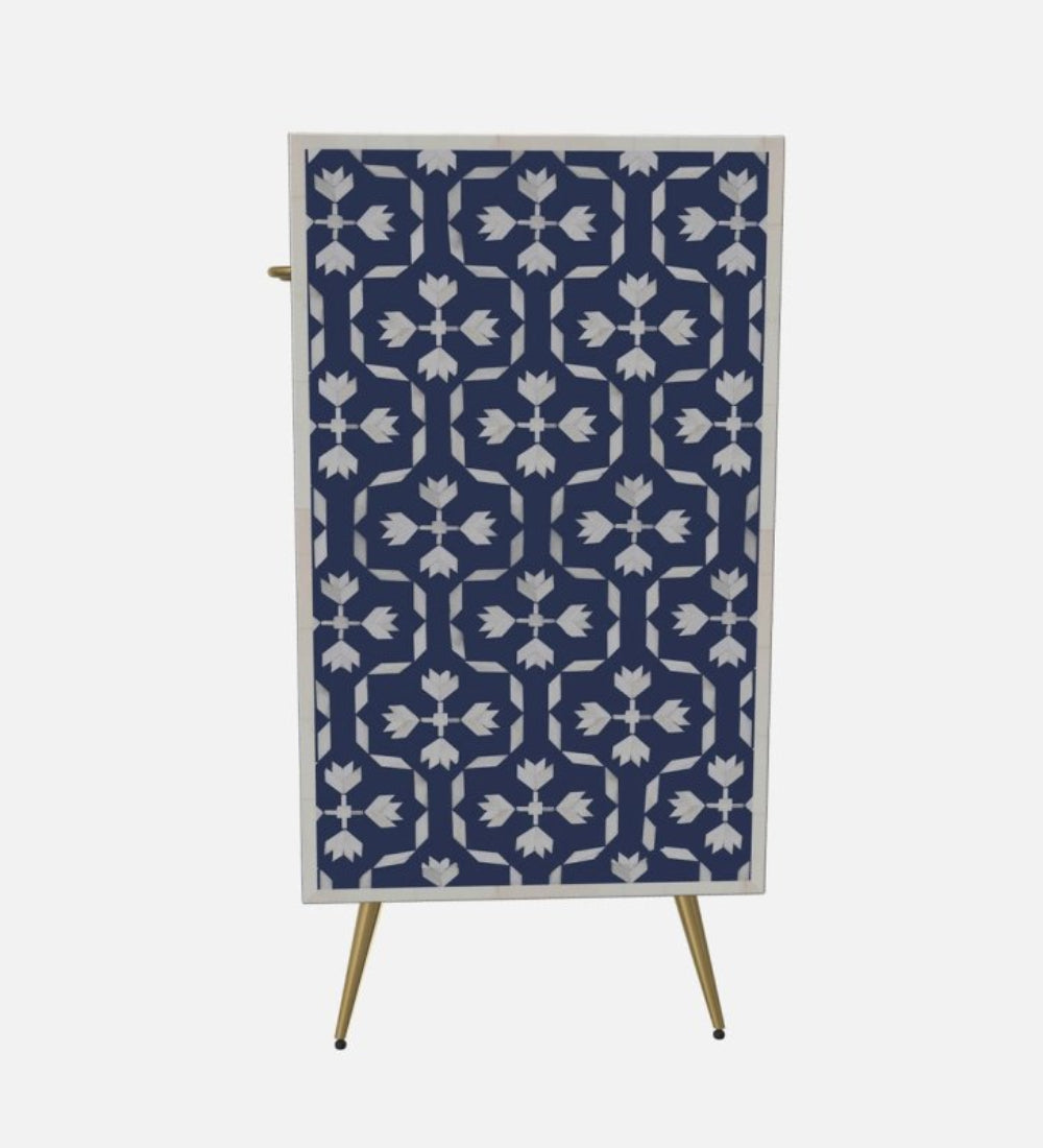 Artisan bone inlay cabinet in navy blue with repeating tulip and cross inlay motif and tapered brass legs