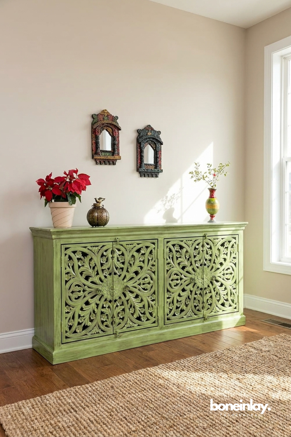 Vintage sage green carved buffet showcasing intricate floral scrollwork and timeless artisan craftsmanship.