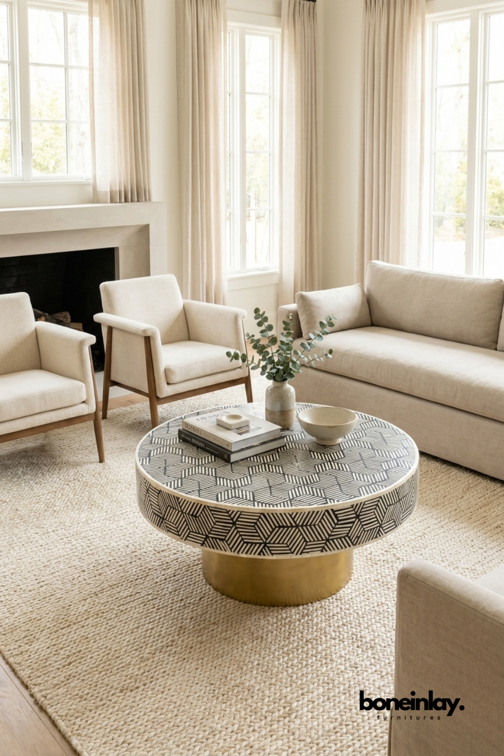 Handcrafted round bone inlay coffee table with black and white geometric cube pattern and gold brass pedestal base on white background