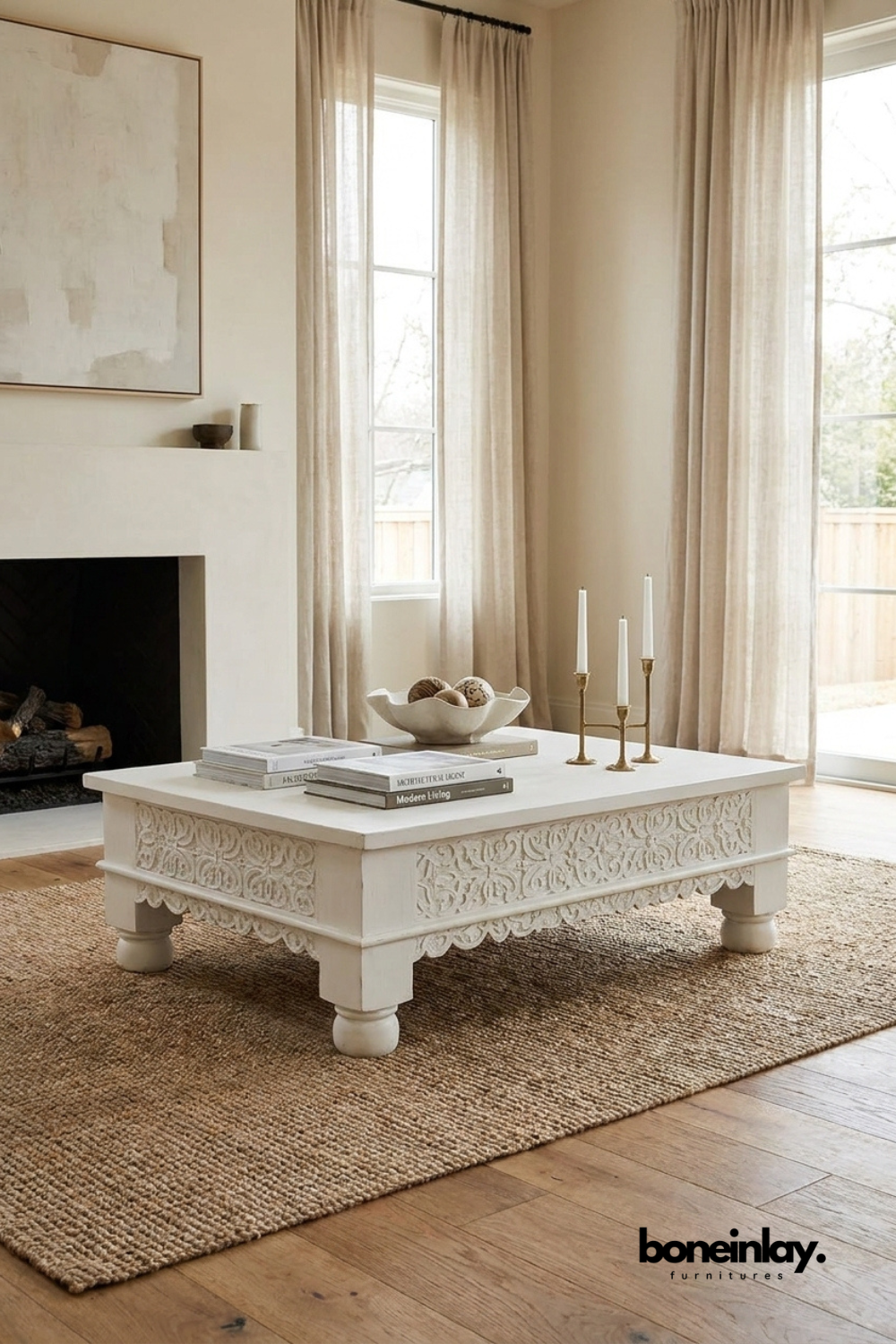 White carved wooden coffee table with hand carved apron details and turned legs in a contemporary living room