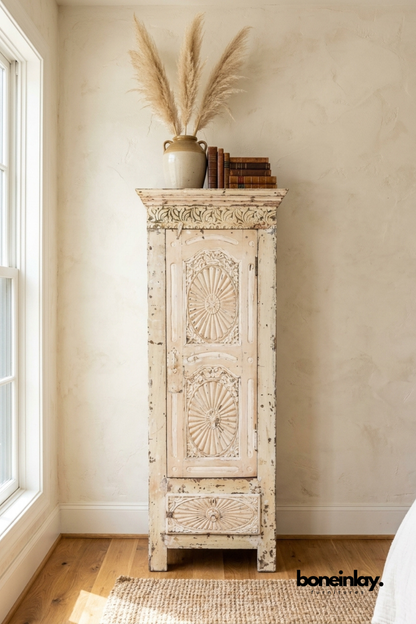 Handcrafted distressed solid wood tall cabinet featuring carved sunburst door panels, vintage finish, single door storage, and rustic accent cabinet for bedroom or living room.