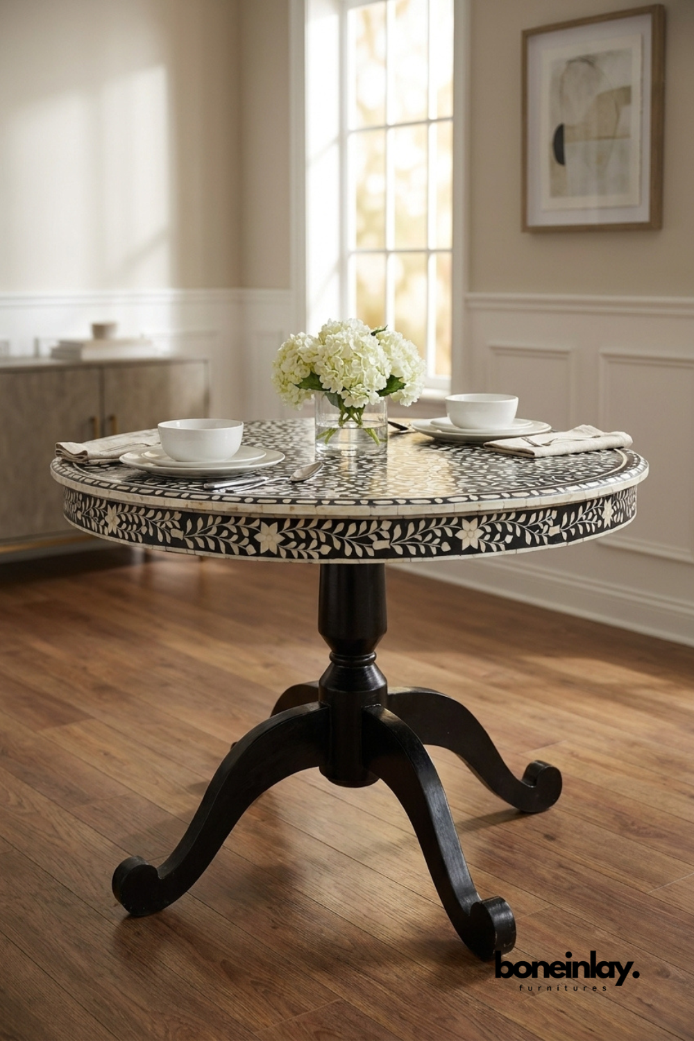 Round black and white bone inlay pedestal dining table featuring handcrafted floral inlay pattern, solid wood base, and elegant dining room design.