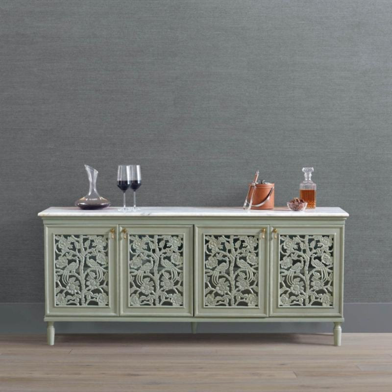 Solid wood floral buffet with a rustic finish, front view showing four carved doors and drinks arranged on top.