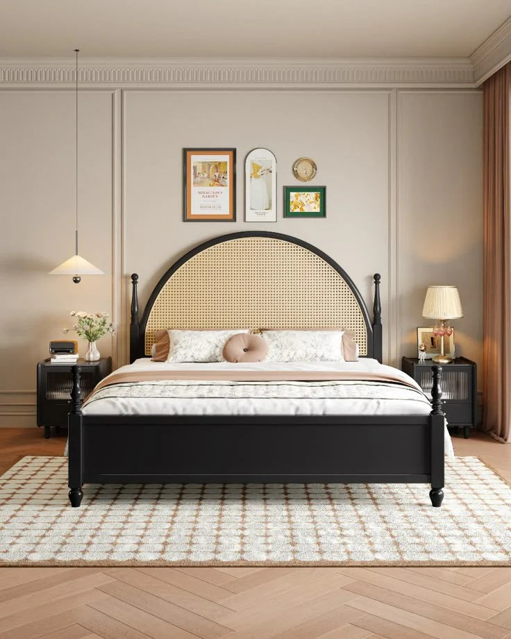 Atom modern black solid wood platform bed frame with large arched natural woven rattan cane headboard in a styled bedroom setting.