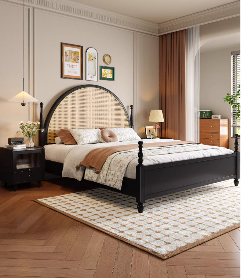 Atom modern black solid wood platform bed frame with large arched natural woven rattan cane headboard in a styled bedroom