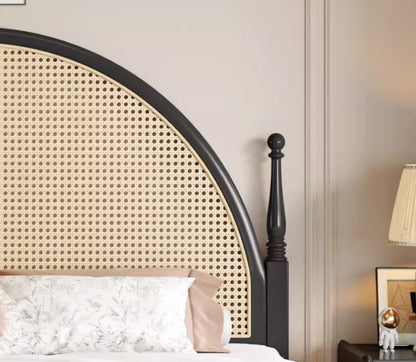 Round rattan headboard with wooden post quite luxury bed in a bedroom 