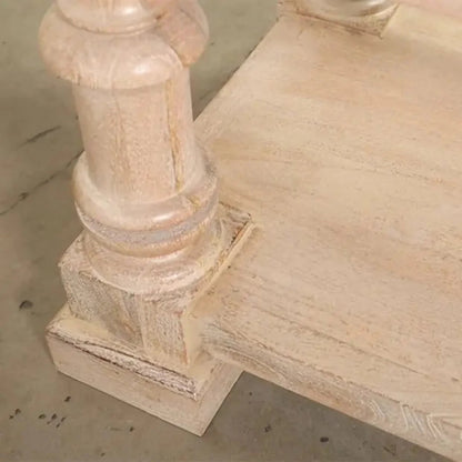 Baluster-leg hallway table in light natural wood, close-up of the turned foot against a neutral studio background.