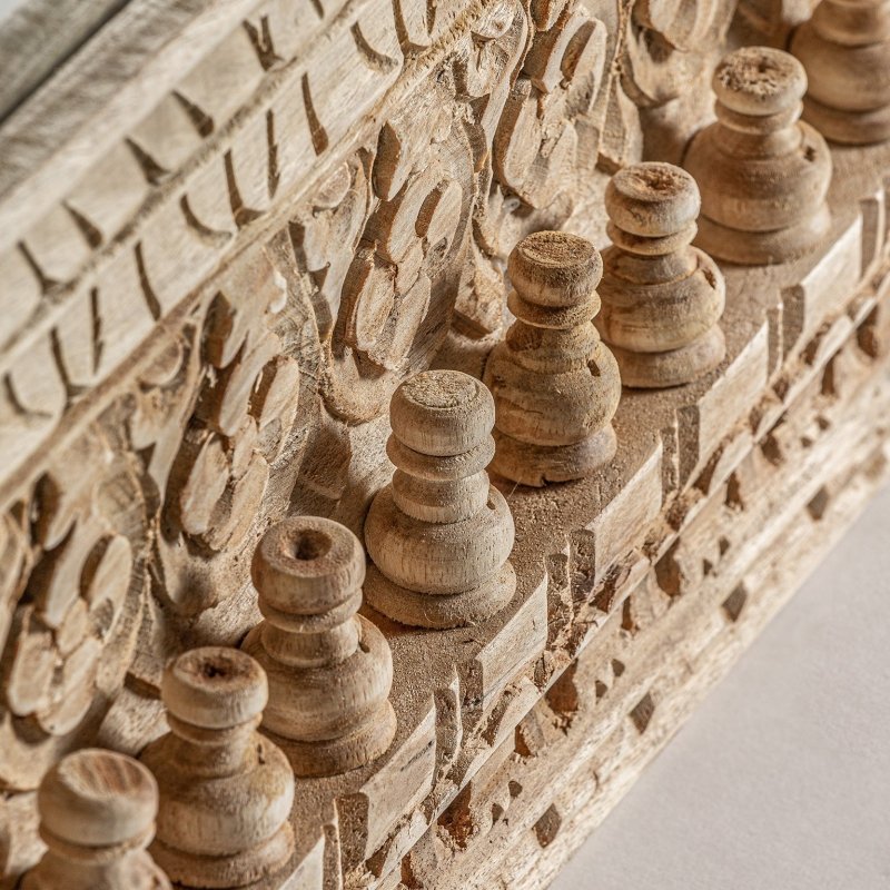 Beaded solid wood accent mirror with a rustic finish, edge detail view showing turned ornaments beside carved flowers.
