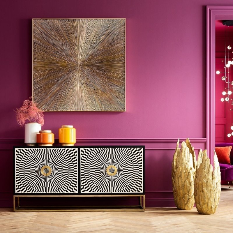 Black bone inlay buffet cabinet with four-door starburst inlay design, circular gold brass pulls, and slim gold open frame metal base