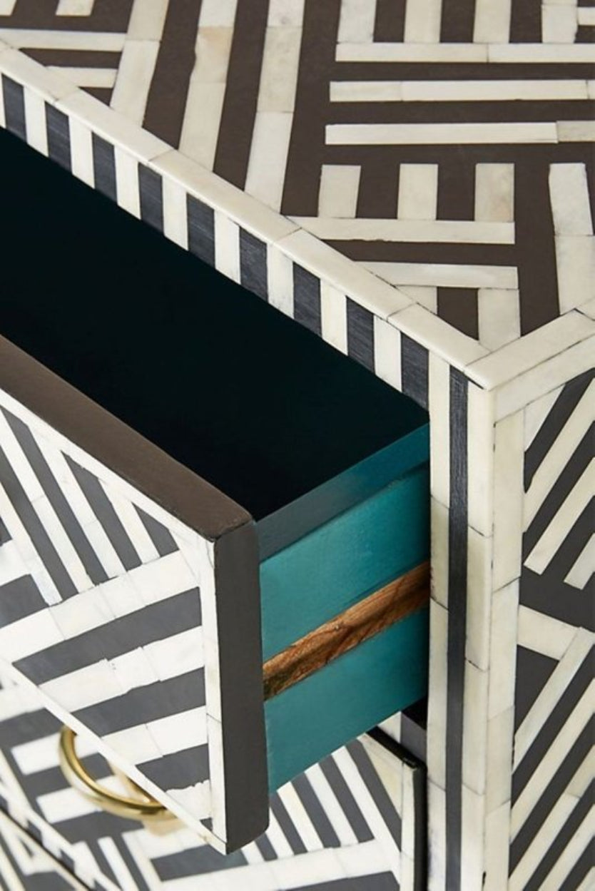 Black Open Drawer Chest with white bone inlay, shown with an upper drawer open to reveal its dark interior.