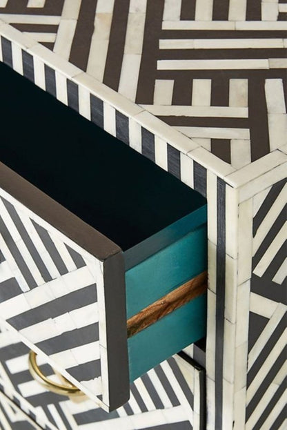 Black Open Drawer Chest with white bone inlay, shown with an upper drawer open to reveal its dark interior.