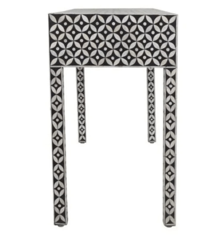 Handcrafted black and white bone inlay console table featuring intricate geometric inlay pattern across the full surface, three seamless drawers, slender Parsons-style legs — made in India.
