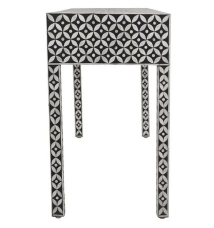 Handcrafted black and white bone inlay console table featuring intricate geometric inlay pattern across the full surface, three seamless drawers, slender Parsons-style legs — made in India.