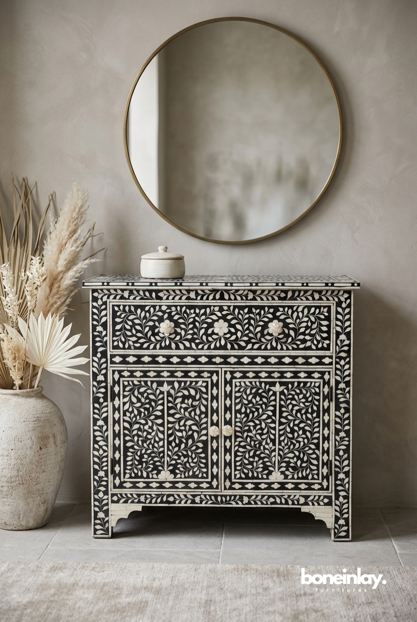 Black bone inlay storage cabinet with all-over ivory floral vine inlay, 1 drawer, 2 doors with bone knobs and diamond border, white background