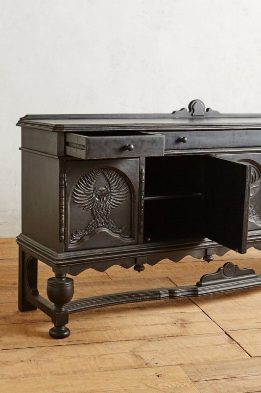 Black Carved Storage Sideboard in wood, open drawer view with a round knob, owl-carved door, and exposed cabinet shelf.