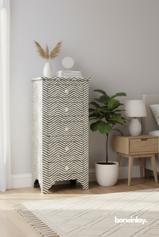 Black and white chevron bone inlay tallboy dresser with 5 drawers, handcrafted mango wood, styled in modern bedroom setting.