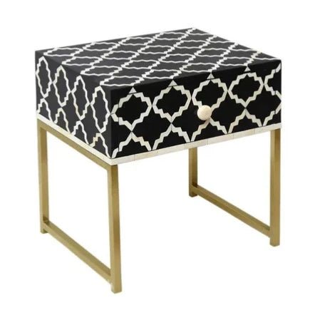 Handmade black and white quatrefoil pattern bone inlay bedside table with single drawer, white bone pull knob, and sleek brass gold metal base frame.