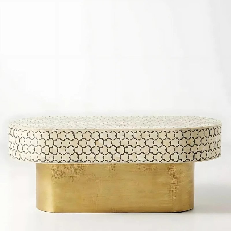 White bone inlay oval tea table with geometric star pattern and brass base, angled side view showing the recessed base