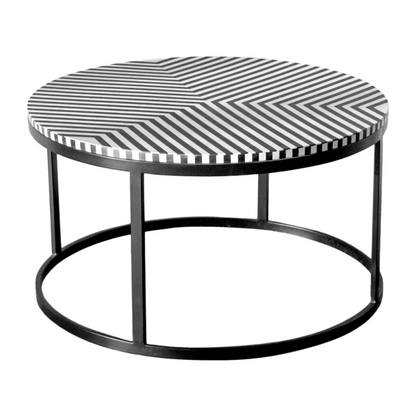 Black and white striped bone inlay round coffee table with minimalist black metal drum frame, artisan handcrafted luxury center table on white background