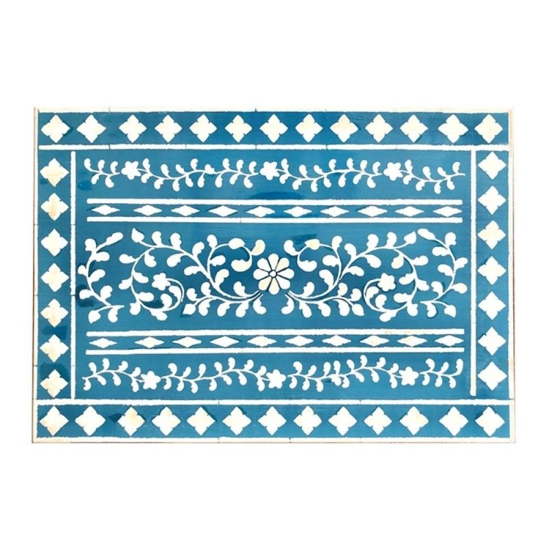 Full flat view of handmade blue floral bone inlay nightstand tabletop showing white flower, vine scroll, diamond border, and leaf garland pattern rows on deep teal blue resin base.