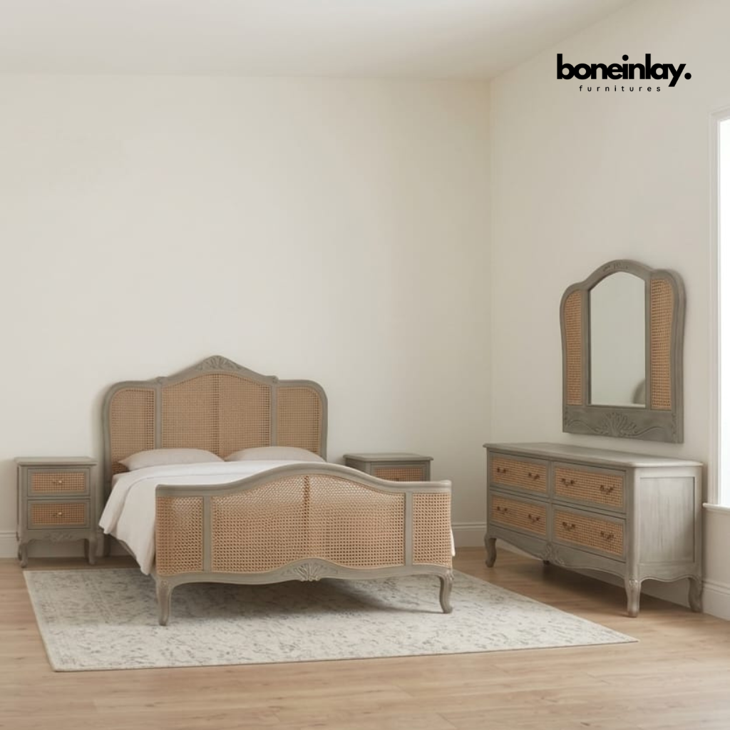 Boho-chic 5-piece French style carved cane bedroom set with natural rattan bed frame, dresser, two nightstands, and mirror in coastal cottage style
