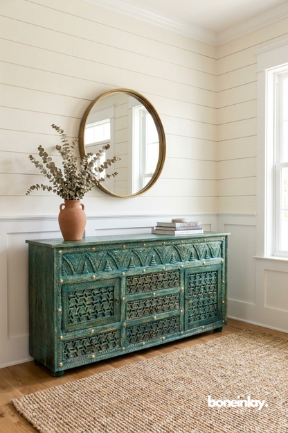 Vintage turquoise cabinet highlighted by geometric lattice carvings and rich handcrafted character.