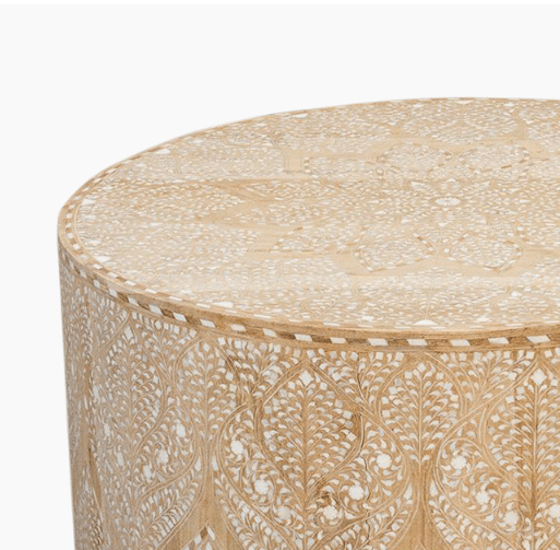Close-up of bone inlay coffee table top and upper side, showing intricate white Moroccan floral inlay pattern on natural bleached solid wood surface