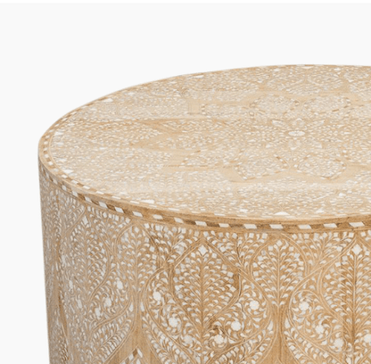 Close-up of bone inlay coffee table top and upper side, showing intricate white Moroccan floral inlay pattern on natural bleached solid wood surface