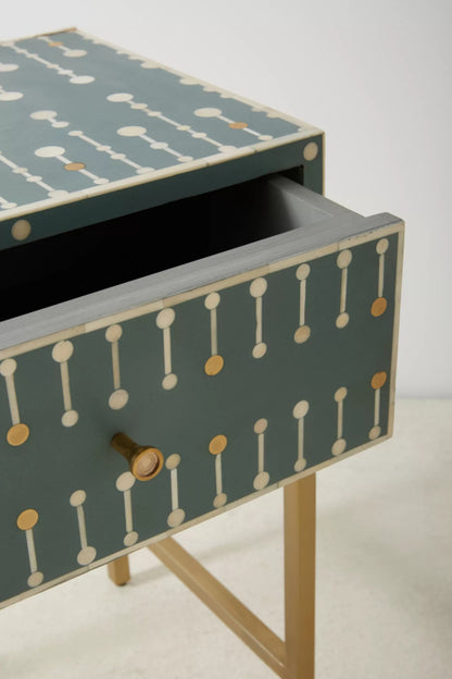 Detailed view of teal bone inlay nightstand drawer with round brass knob, showcasing handcrafted white and gold dot-dash geometric bone inlay mosaic on mango wood.