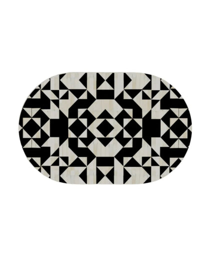 Flat lay of bone inlay oval tabletop featuring intricate black and white geometric medallion pattern handcrafted artisan design