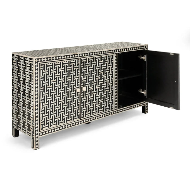 Black and white bone inlay three-door sideboard with right door open revealing two black interior shelves, full basket weave mosaic on all sides and top, mango wood construction.