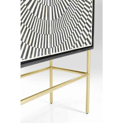 Detail of lower bone inlay sunburst pattern and brushed gold metal base frame of handmade artisan bar cabinet with geometric black white inlay